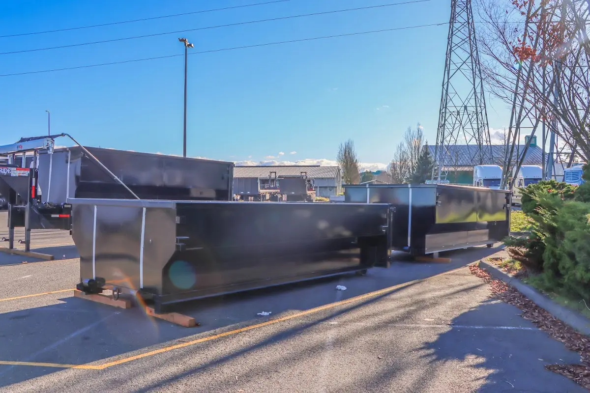 Roll-off dumpster ready for waste disposal at job site for 12 Yard Dumpster Rental in Roma